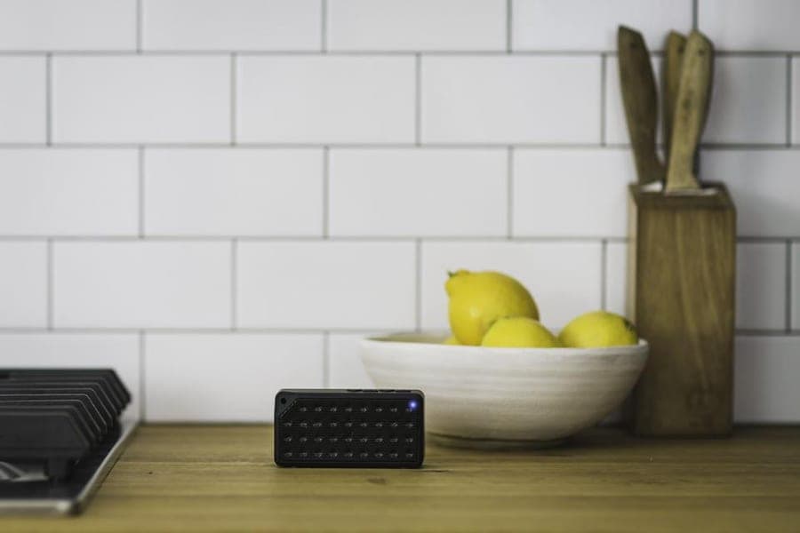 A Kin Sense unit resting on a kitchen counter